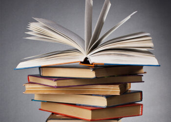 businessman balancing on tightrope city